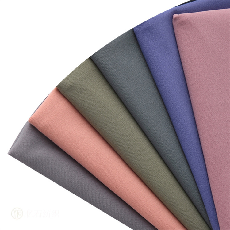 85% پلی استر 15% اسپندکس پارچه لباس شنای بافتنی نرم و صاف برای لباس شنای پوشاک 