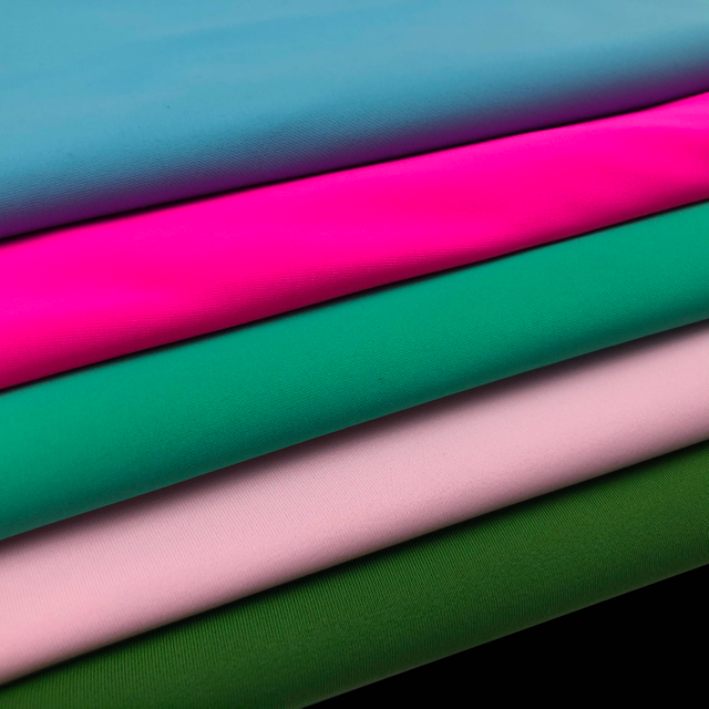 پارچه لباس شنا 85% پلی استر 15% اسپندکس تار بافتنی پلی استر برای پوشاک لباس شنا 